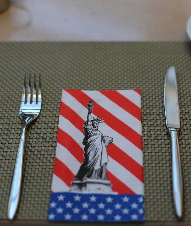 Enjoying a 4th of July dinner outdoors with patriotic decor